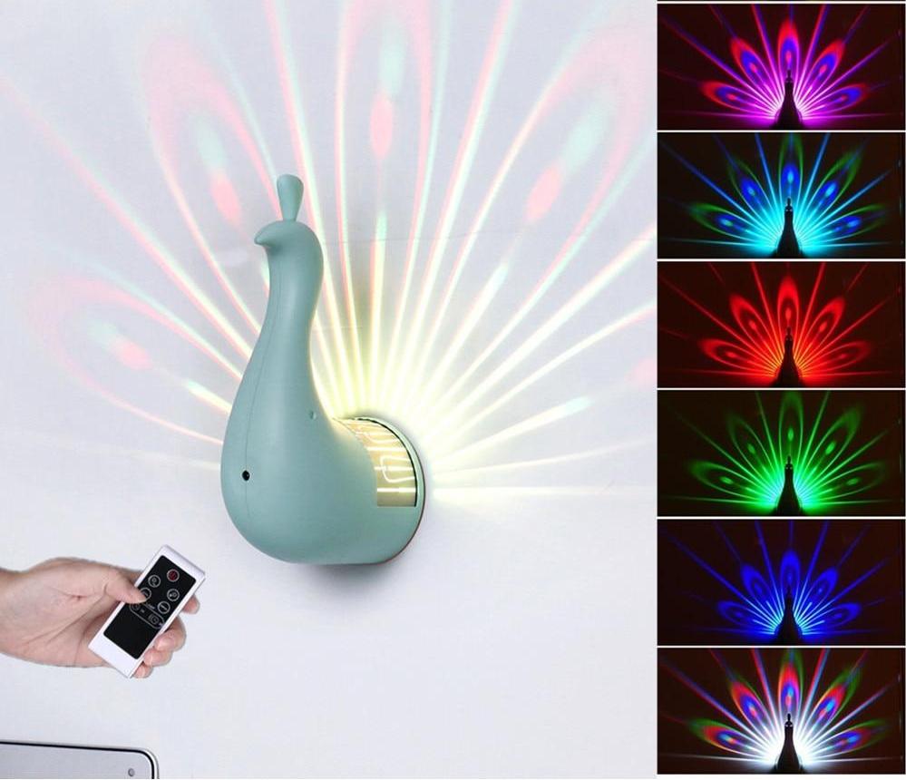 https://fanduco.com/cdn/shop/products/Wall-Lights-Peacock-Shape-LED-Projection-Lamp-Remote-Control-Night-Wall-Lamp-Lamp-Colorful-Night-Light_1400x.jpg?v=1536334916